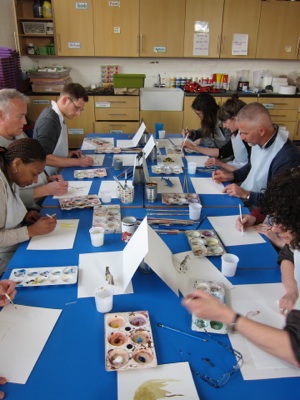 Members of teaching staff painting